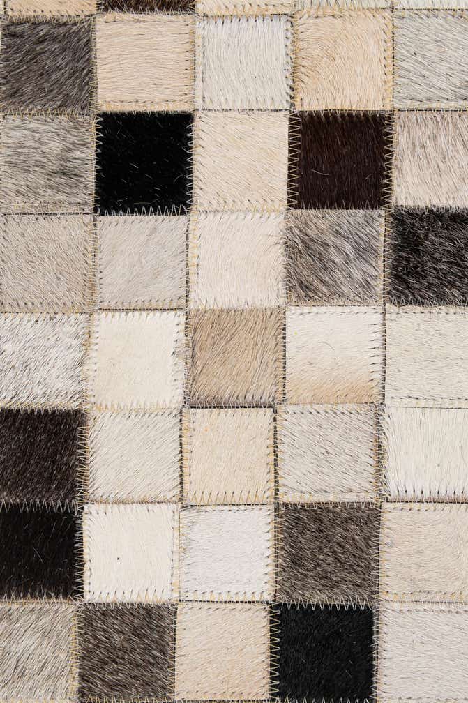 4' 11 x 8' 2 Cowhide - Patchwork Rug