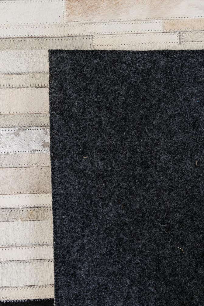 5' 2 x 8' 1 Cowhide - Patchwork Rug