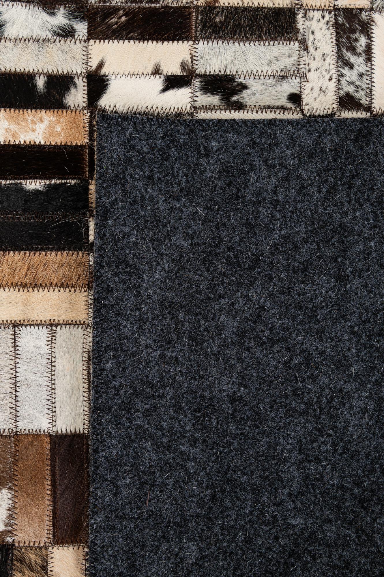 4' 11 x 7' 10 Cowhide - Patchwork Rug