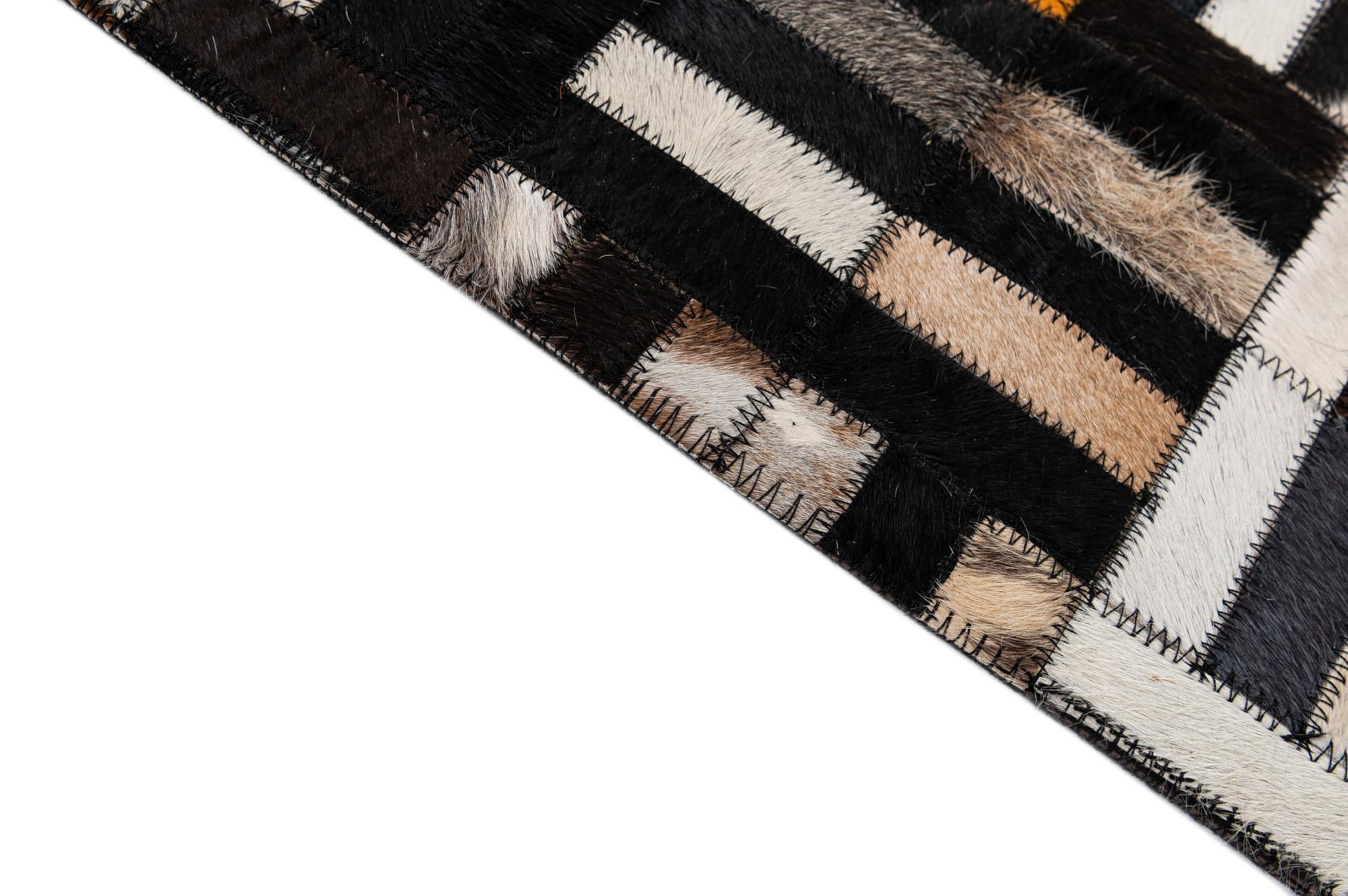 5' 2 x 8' 1 Cowhide - Patchwork Rug