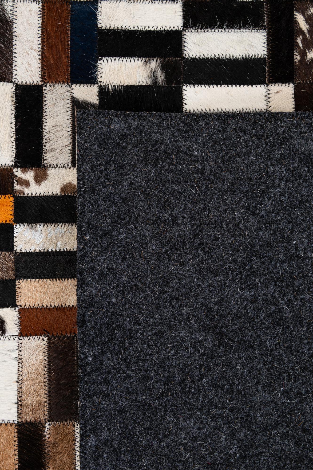 5' 2 x 8' 1 Cowhide - Patchwork Rug