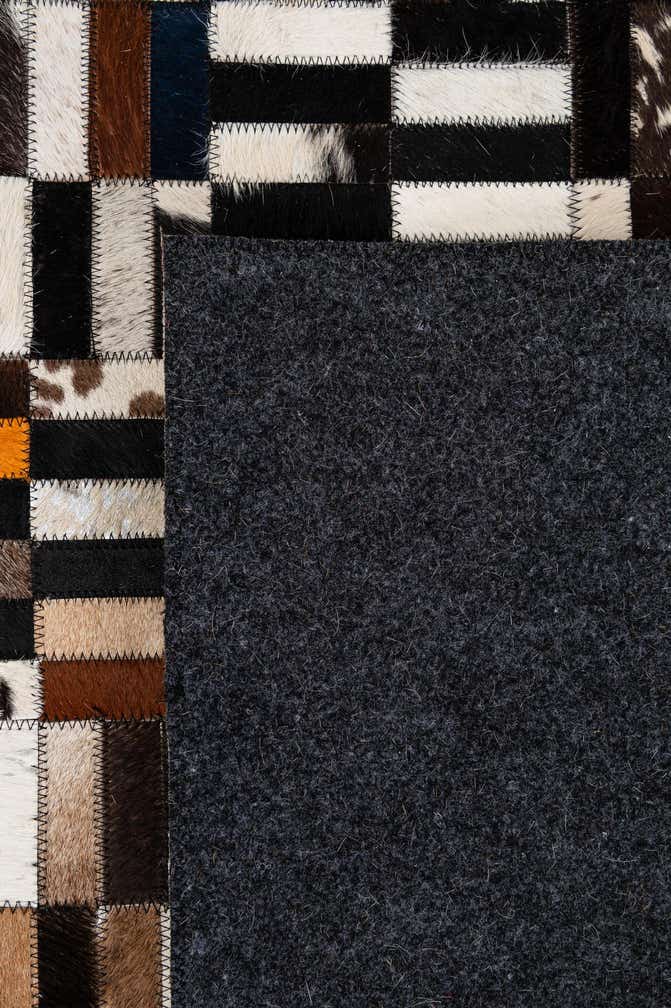 5' 2 x 8' 1 Cowhide - Patchwork Rug