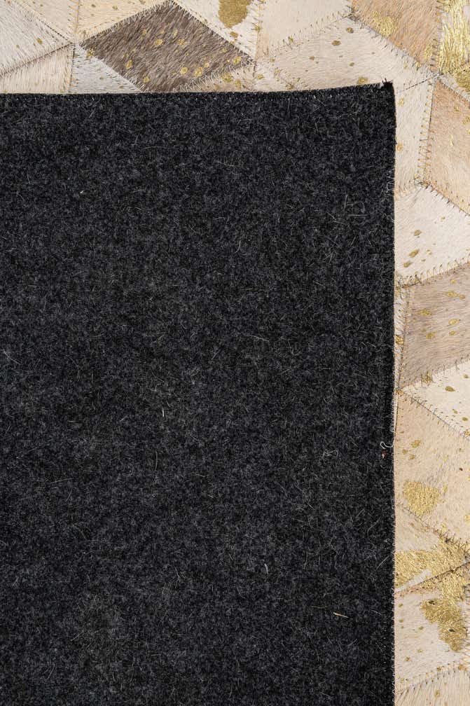 5' 3 x 8' 1 Cowhide - Patchwork Rug