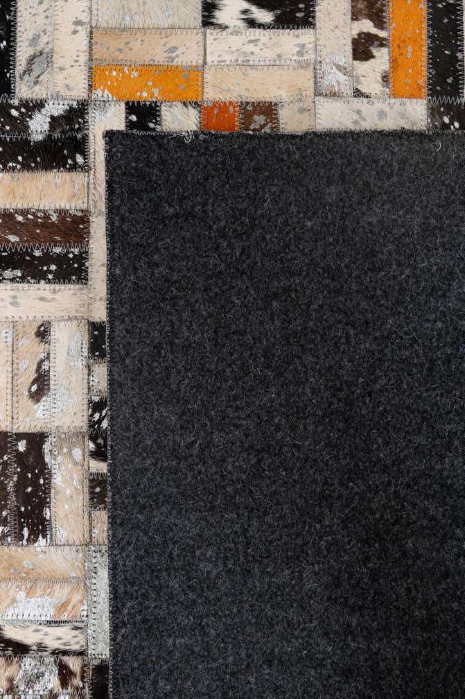 4' 11 x 7' 10 Cowhide - Patchwork Rug