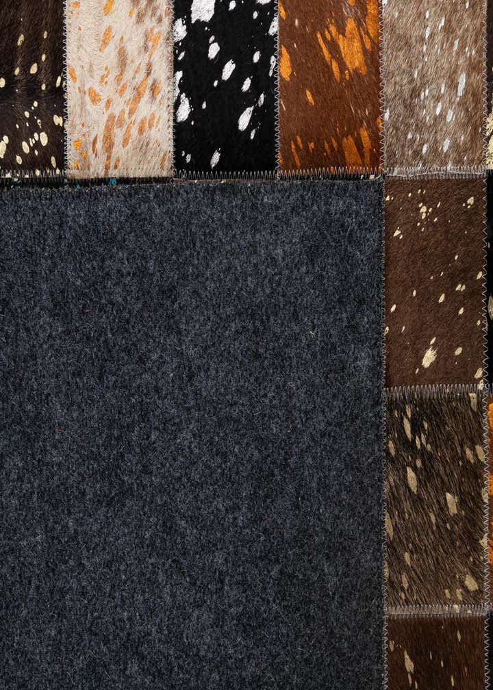 4' 11 x 7' 10 Cowhide - Patchwork Rug