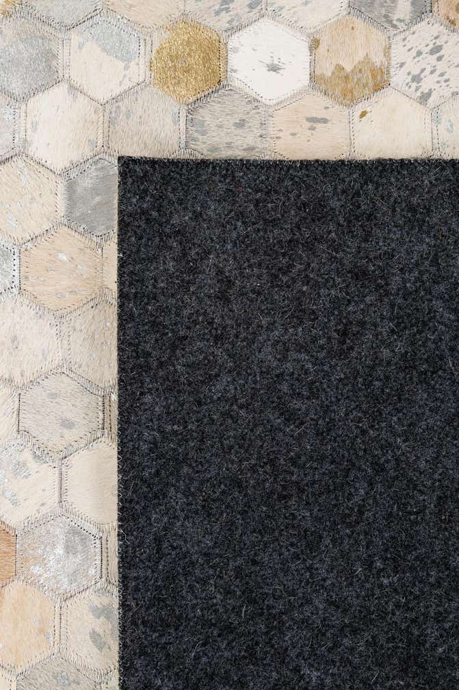5' 2 x 8' 1 Cowhide - Patchwork Rug