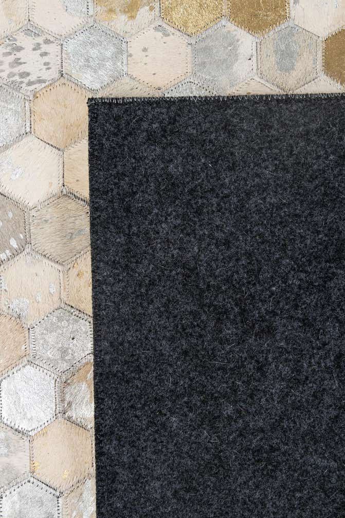 5' 2 x 8' 1 Cowhide - Patchwork Rug