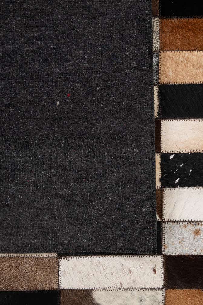 5' 3 x 8' 2 Cowhide - Patchwork Rug