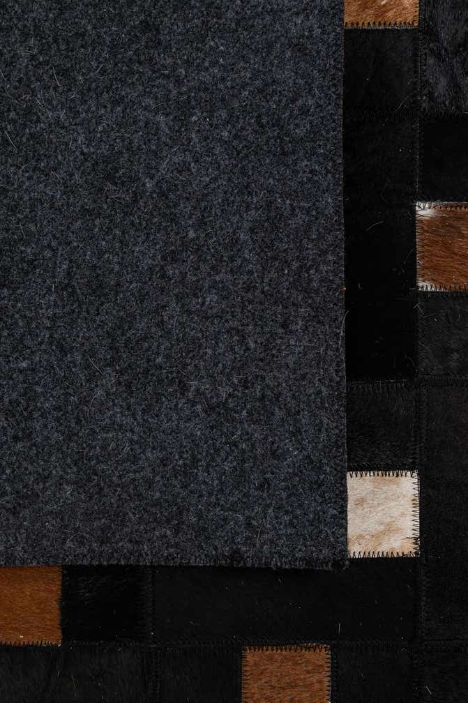 5' 3 x 8' 1 Cowhide - Patchwork Rug