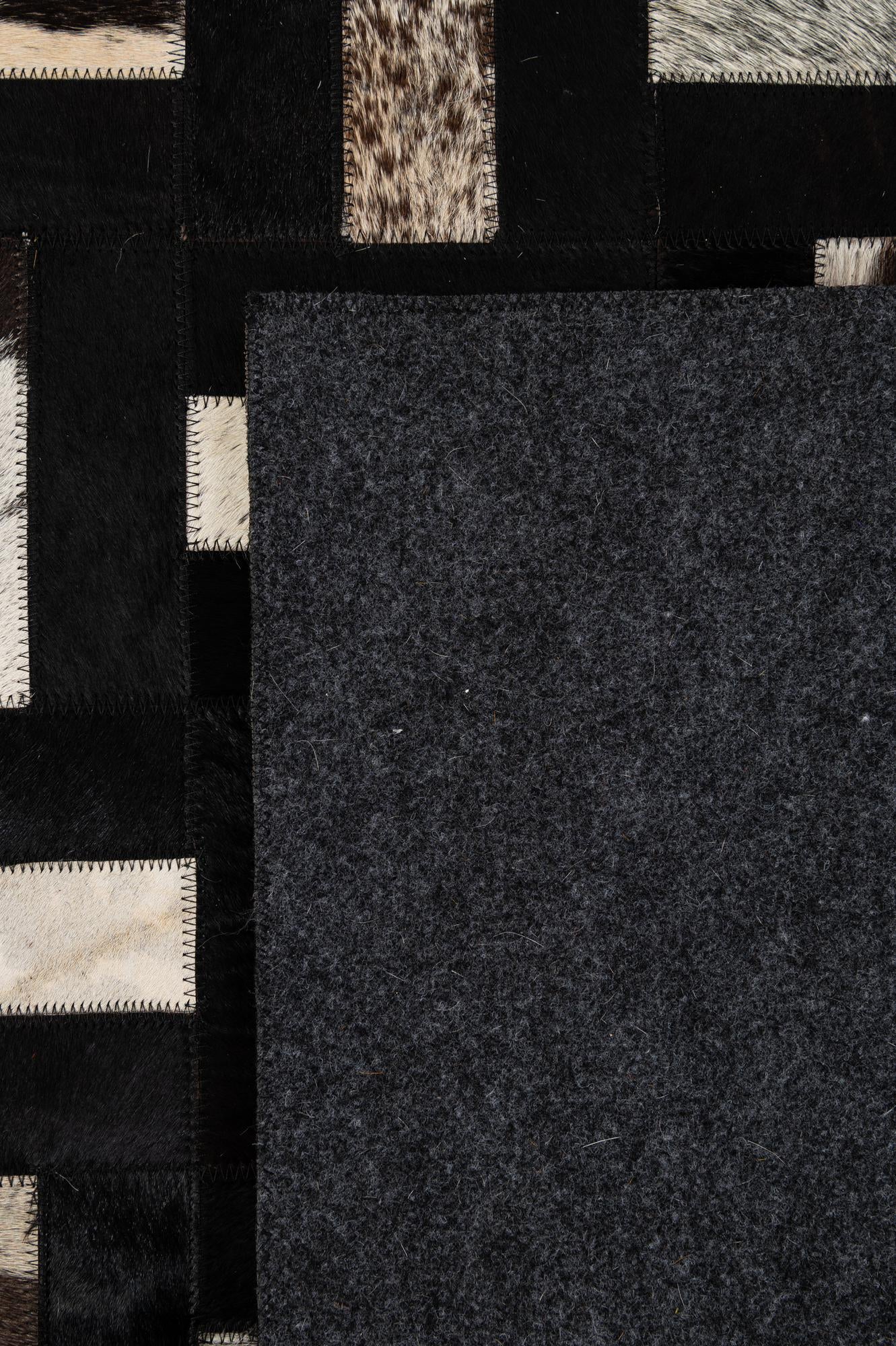 5' 3 x 8' 2 Cowhide - Patchwork Rug