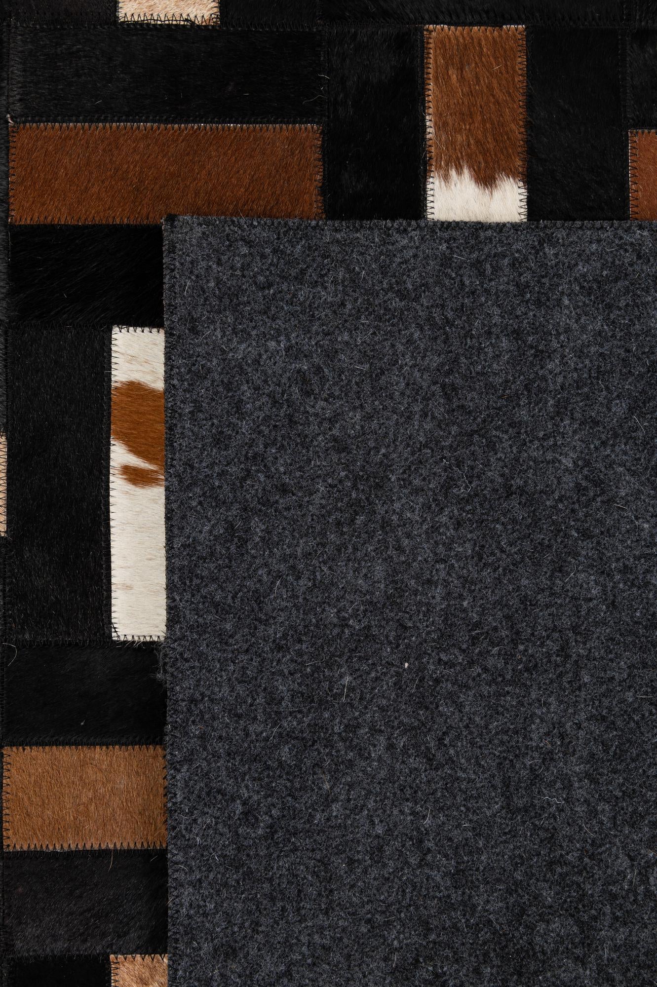 5' 3 x 8' 2 Cowhide - Patchwork Rug