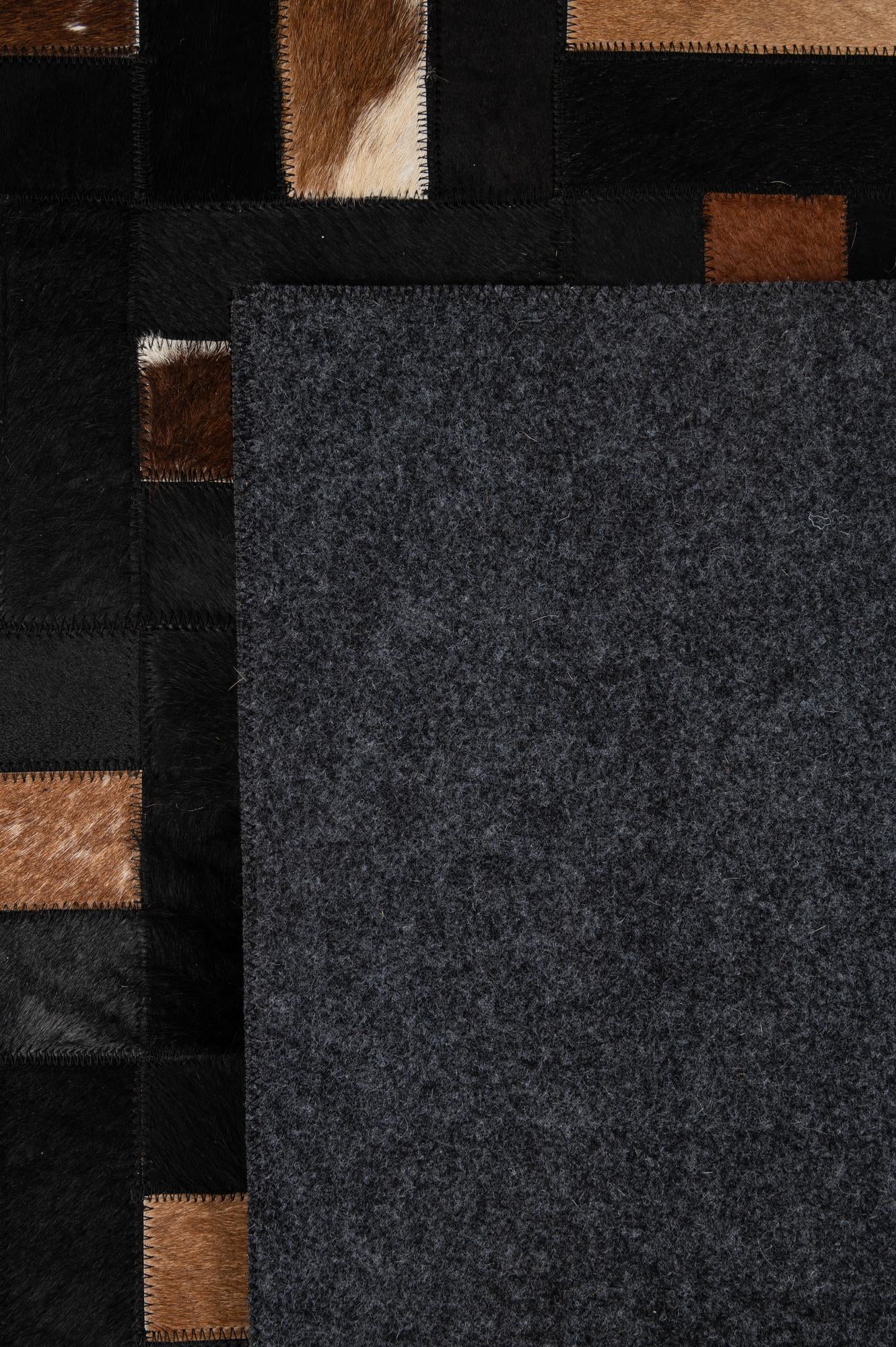 5' 3 x 8' 2 Cowhide - Patchwork Rug