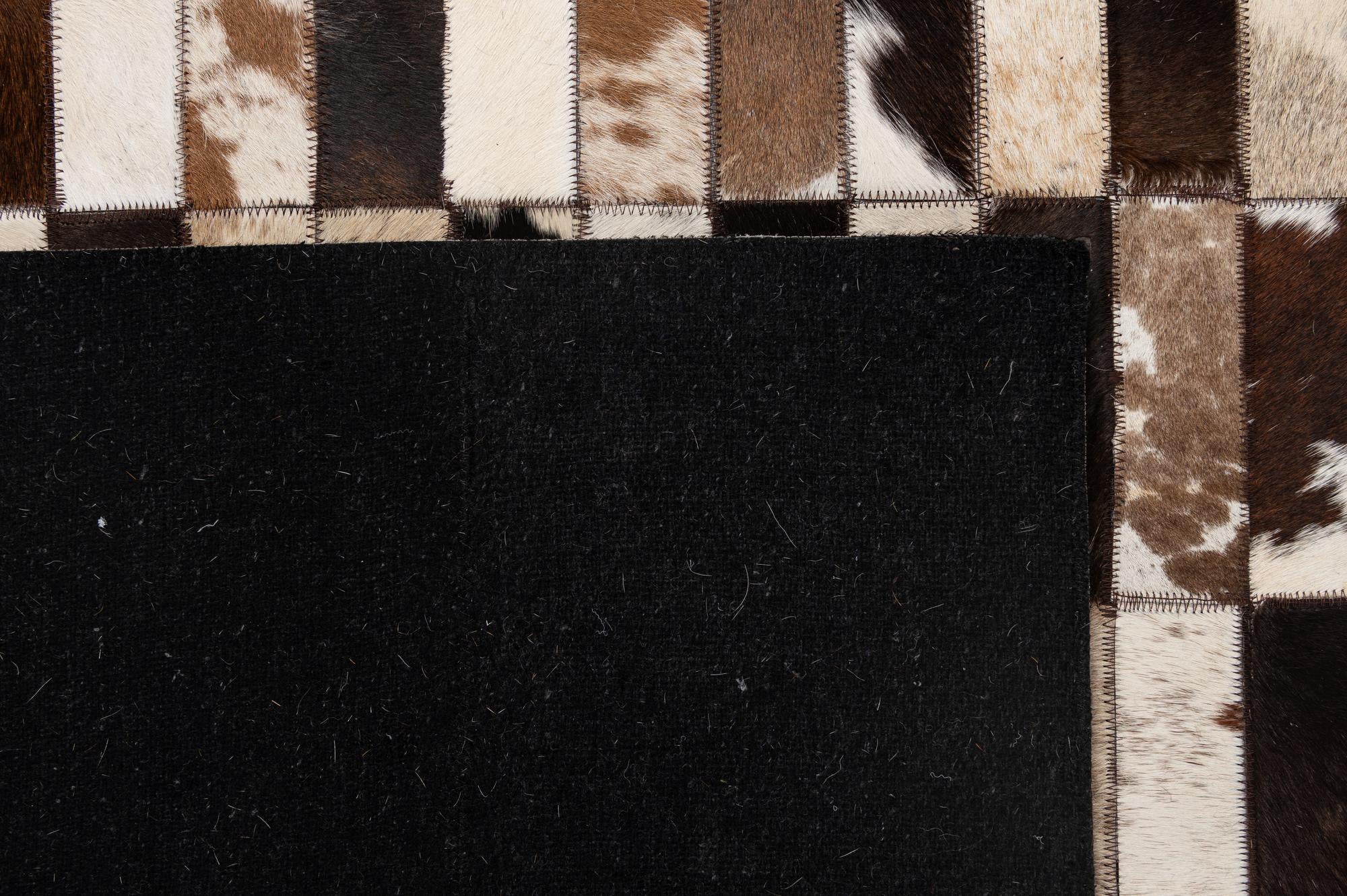 5' 3 x 8' 1 Cowhide - Patchwork Rug