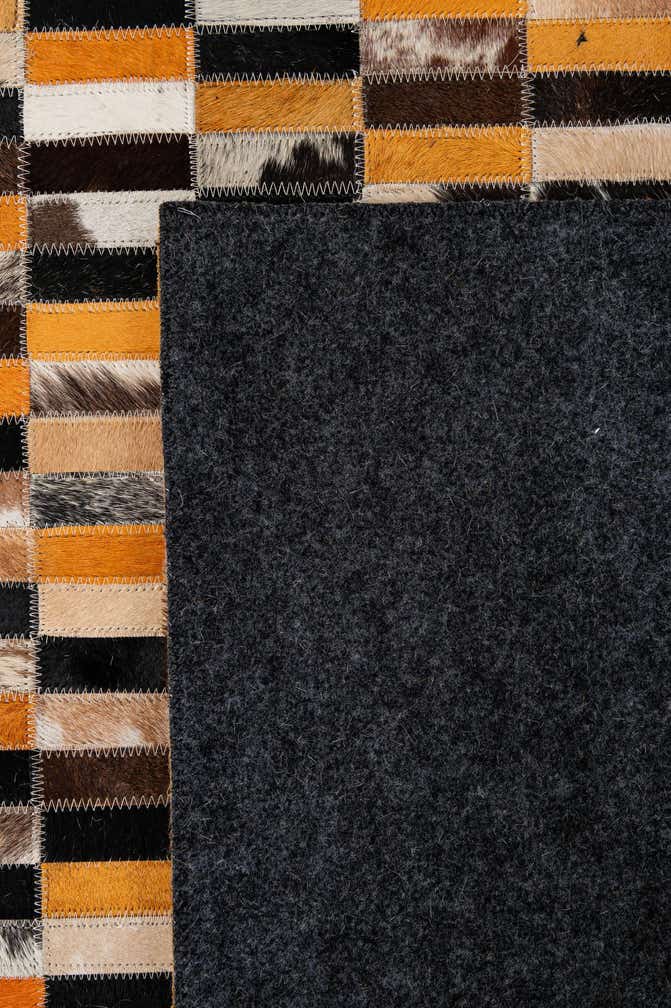4' 11 x 7' 10 Cowhide - Patchwork Rug
