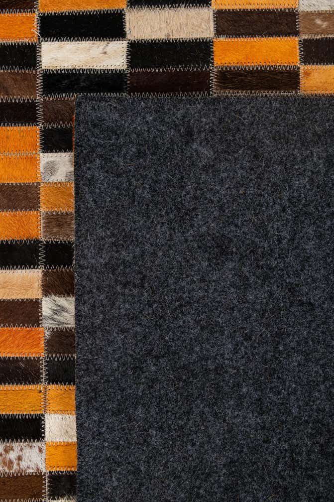 4' 11 x 7' 9 Cowhide - Patchwork Rug