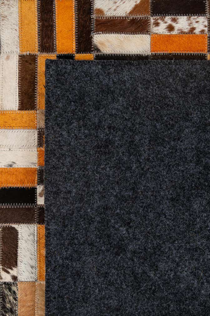 4' 11 x 7' 10 Cowhide - Patchwork Rug