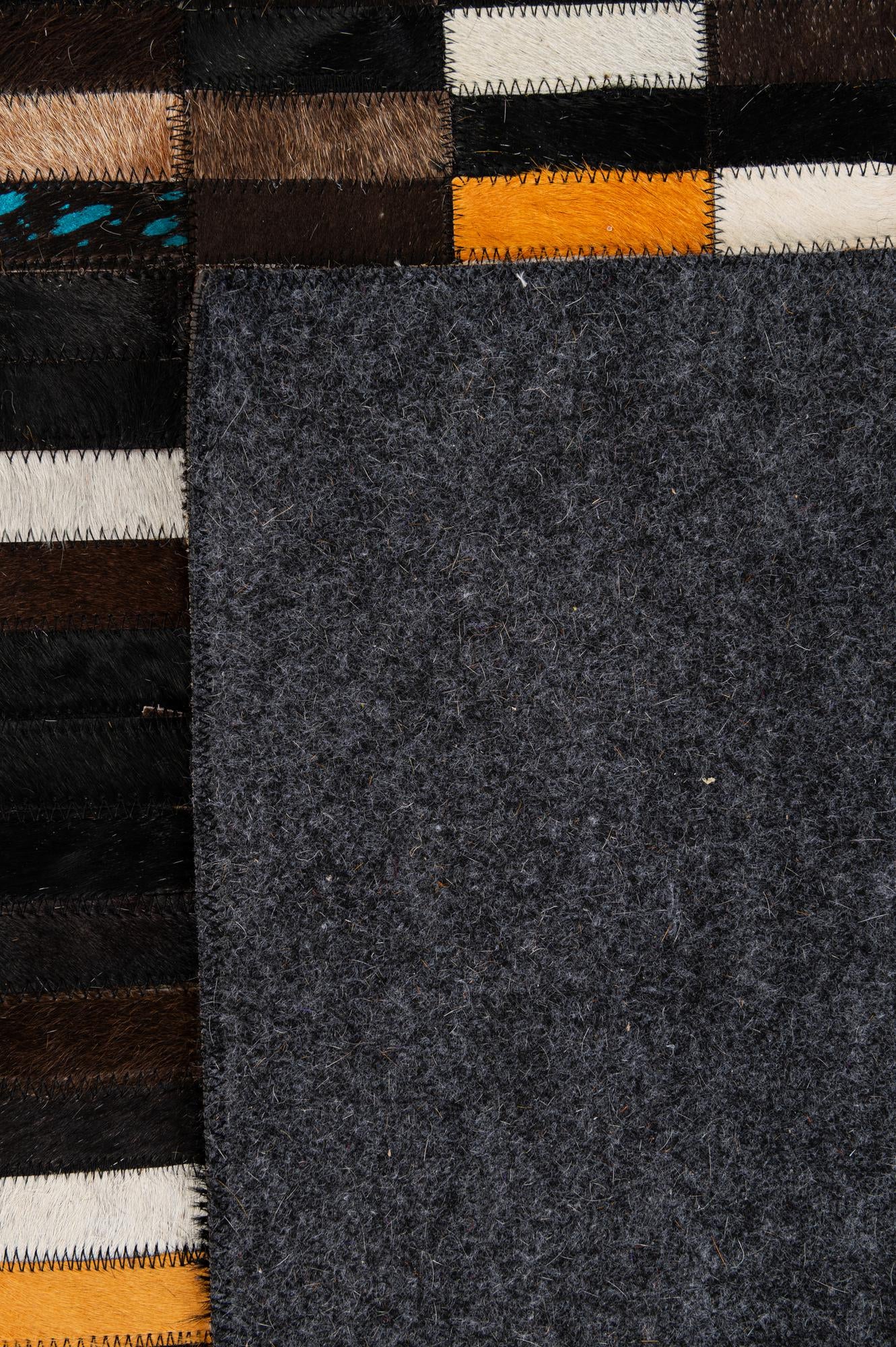 5' 3 x 8' 1 Cowhide - Patchwork Rug