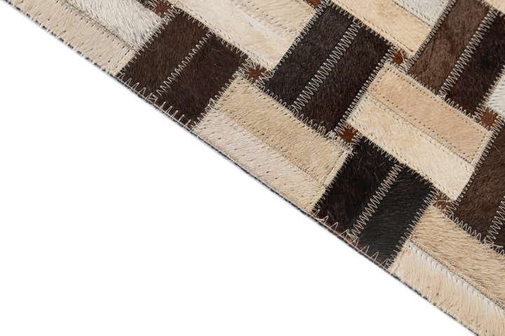 4' 11 x 7' 10 Cowhide - Patchwork Rug