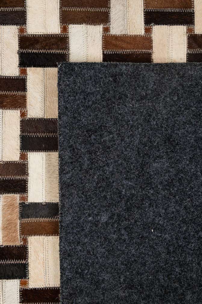 4' 11 x 7' 10 Cowhide - Patchwork Rug