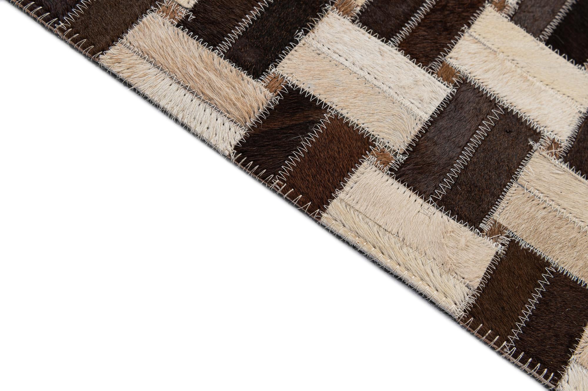 4' 11 x 7' 9 Cowhide - Patchwork Rug