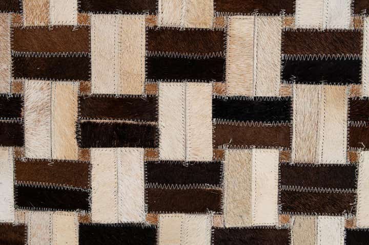 4' 11 x 7' 9 Cowhide - Patchwork Rug