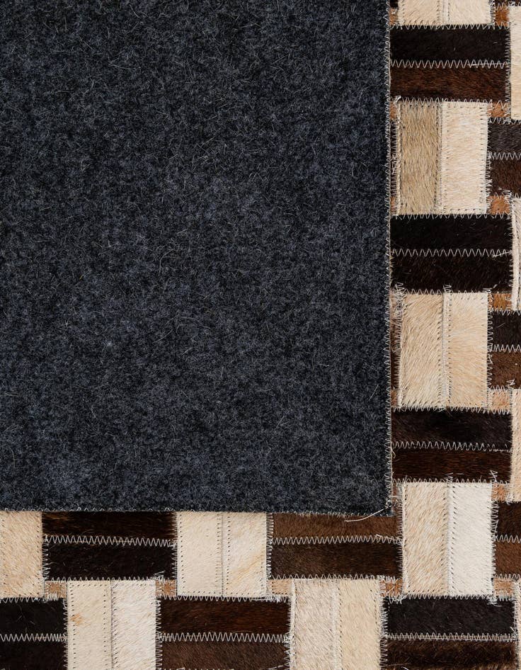 Detail image of 4' 11 x 7' 9 Cowhide - Patchwork Rug