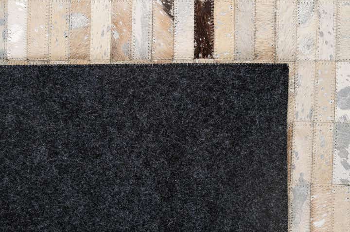 4' 11 x 8' 1 Cowhide - Patchwork Rug