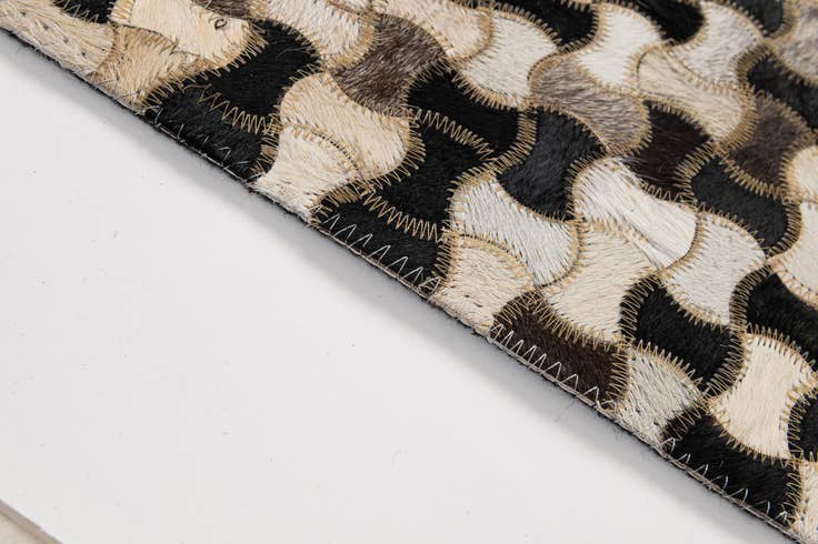 Detail image of 5' 1 x 7' 11 Cowhide - Patchwork Rug