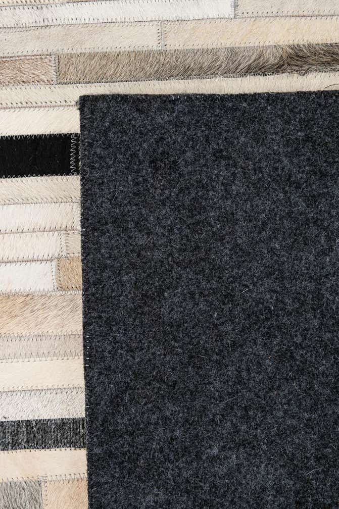 5' 2 x 8' 1 Cowhide - Patchwork Rug