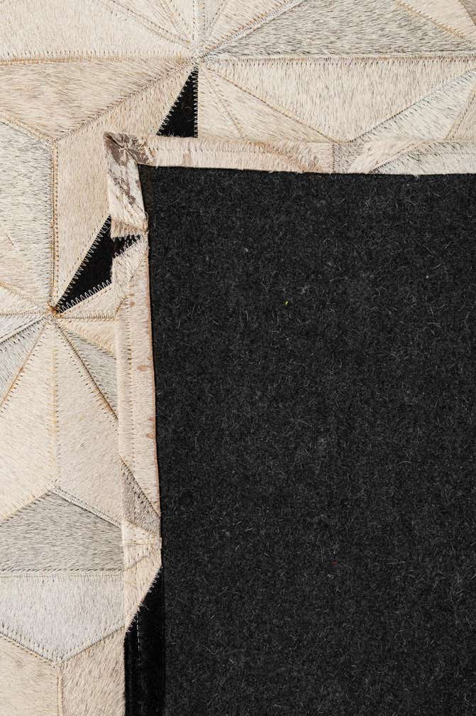 5' 2 x 8' 1 Cowhide - Patchwork Rug