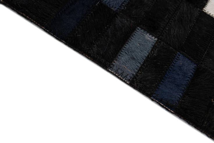 Detail image of 5' 2 x 8' Cowhide - Patchwork Rug