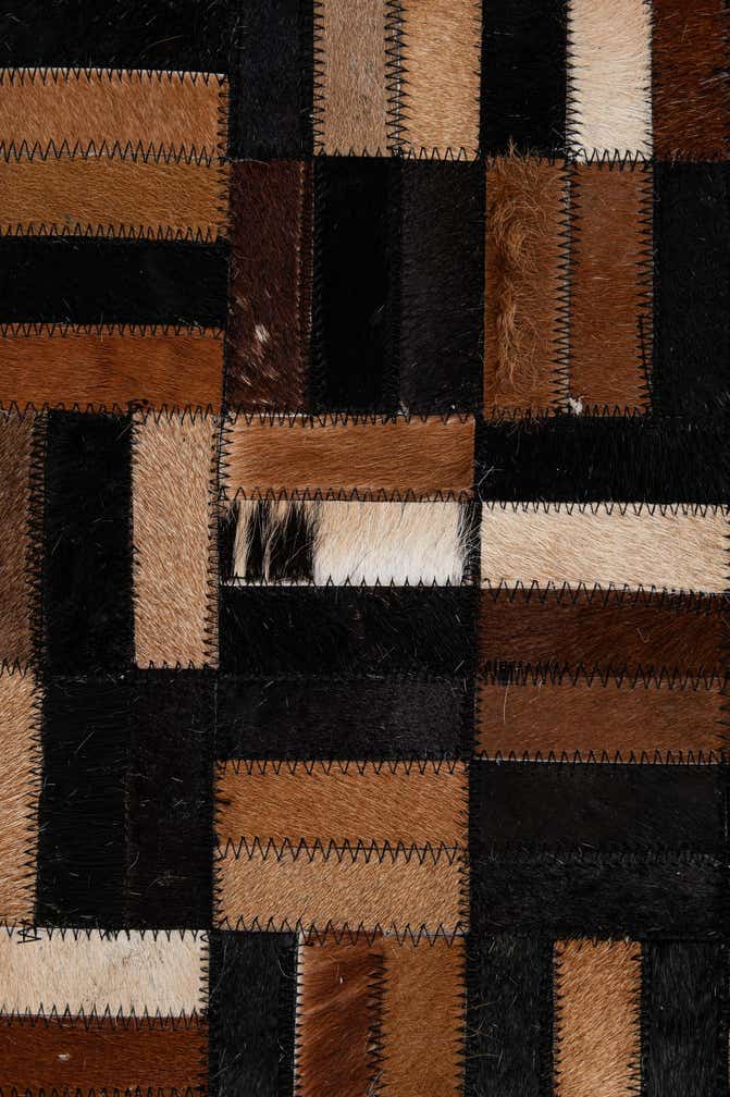 4' 11 x 7' 9 Cowhide - Patchwork Rug