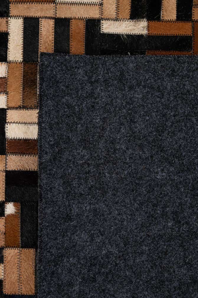 4' 11 x 7' 9 Cowhide - Patchwork Rug