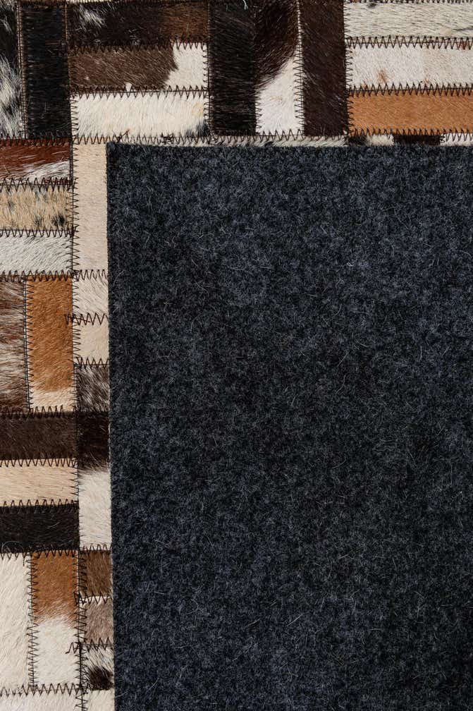 4' 11 x 7' 9 Cowhide - Patchwork Rug