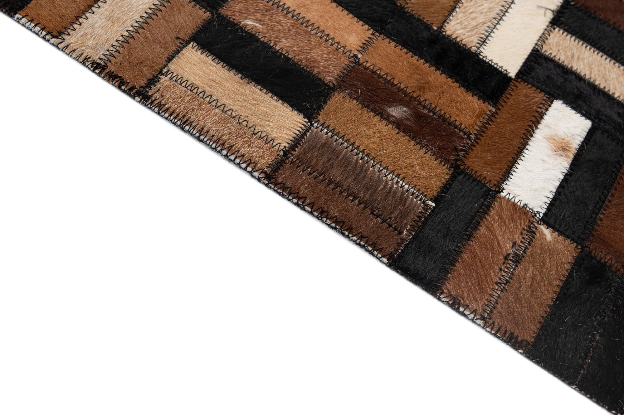 4' 11 x 8' 1 Cowhide - Patchwork Rug