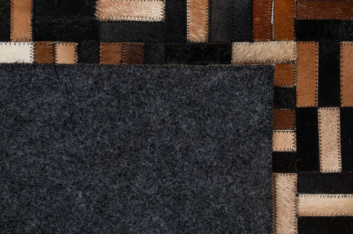 4' 11 x 8' 1 Cowhide - Patchwork Rug