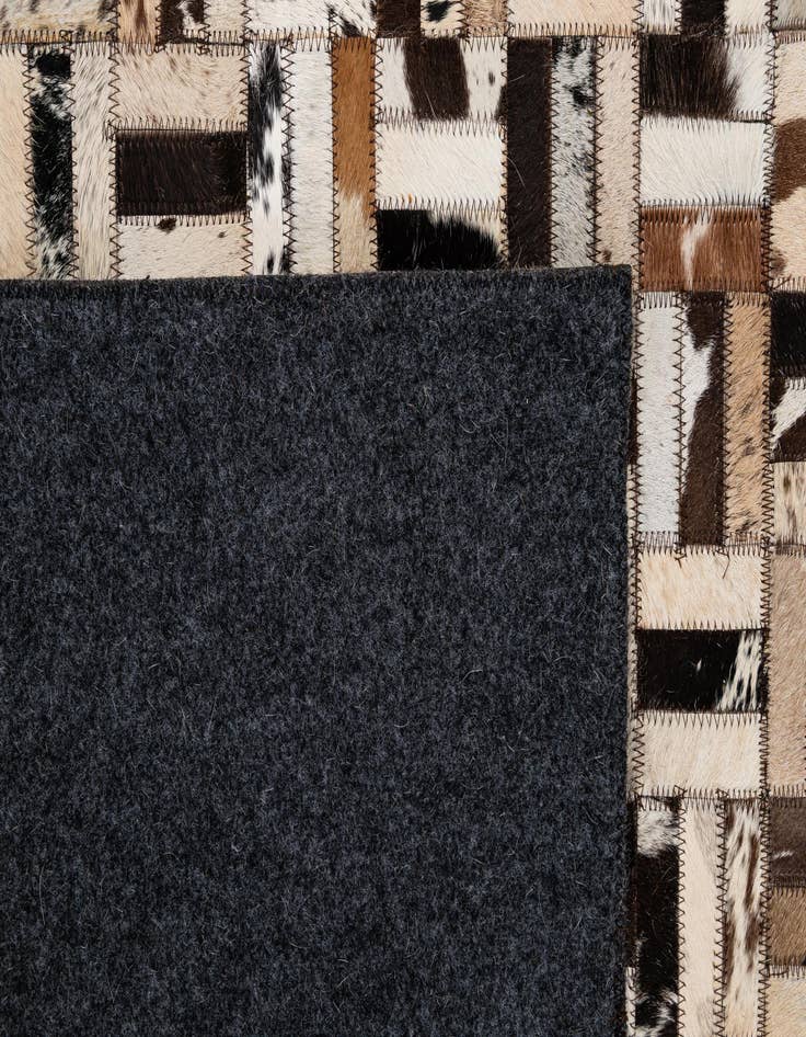 Detail image of 4' 11 x 7' 10 Cowhide - Patchwork Rug