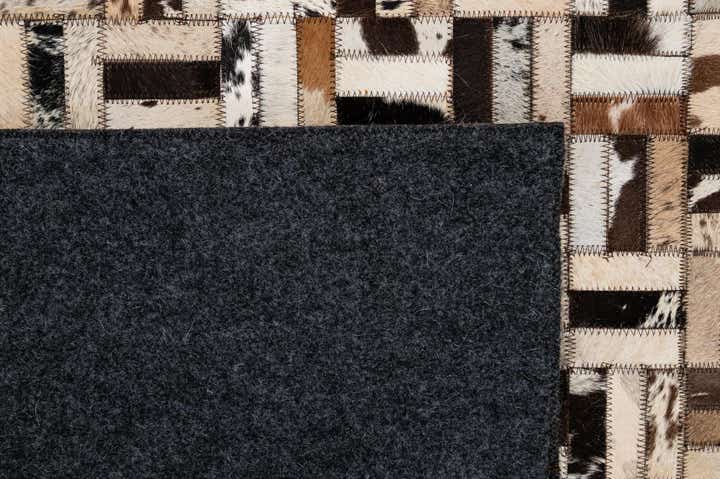4' 11 x 7' 10 Cowhide - Patchwork Rug
