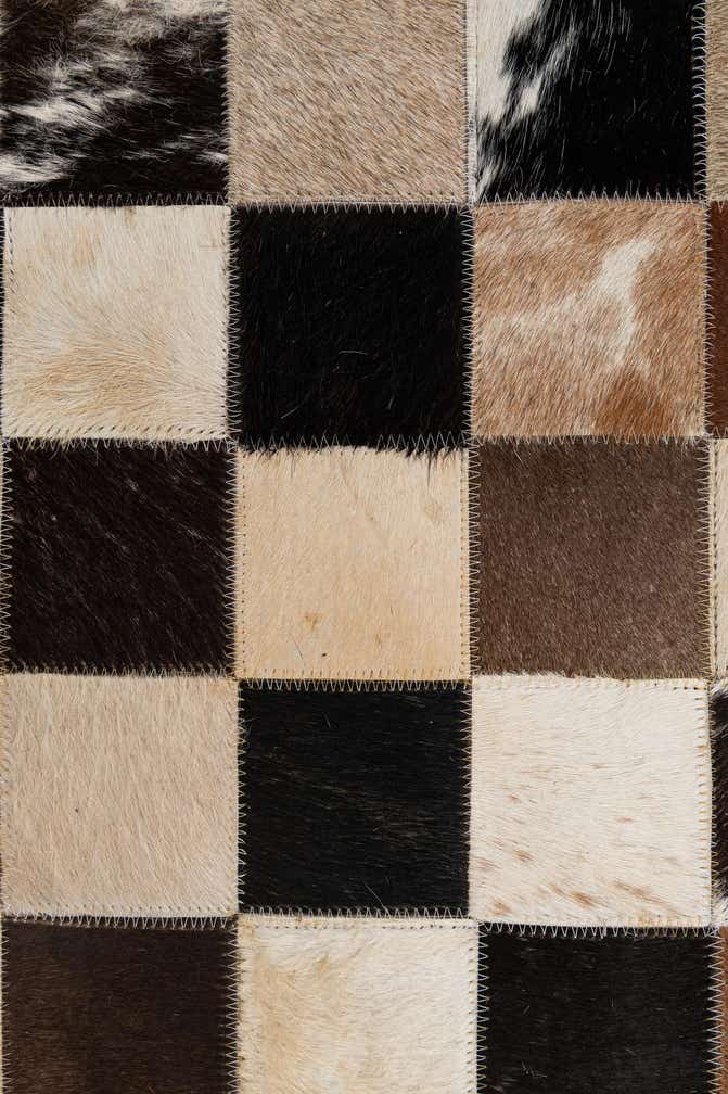 5' 2 x 8' 1 Cowhide - Patchwork Rug