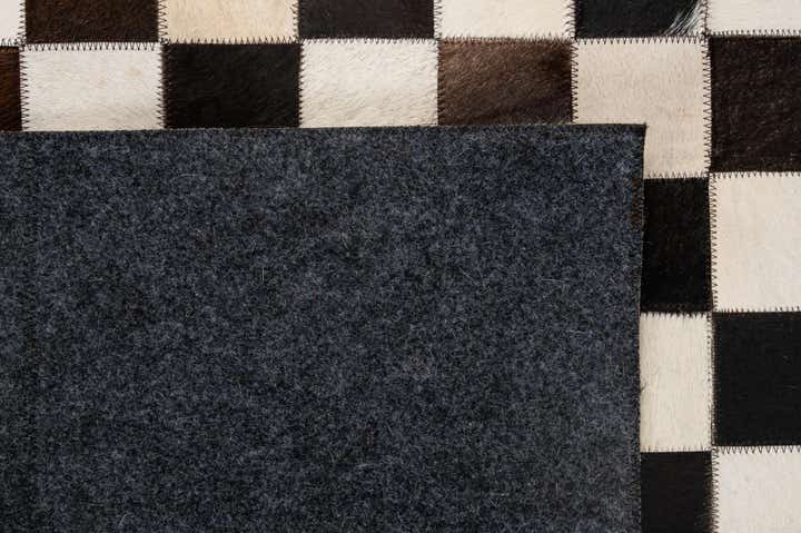 4' 11 x 8' 1 Cowhide - Patchwork Rug