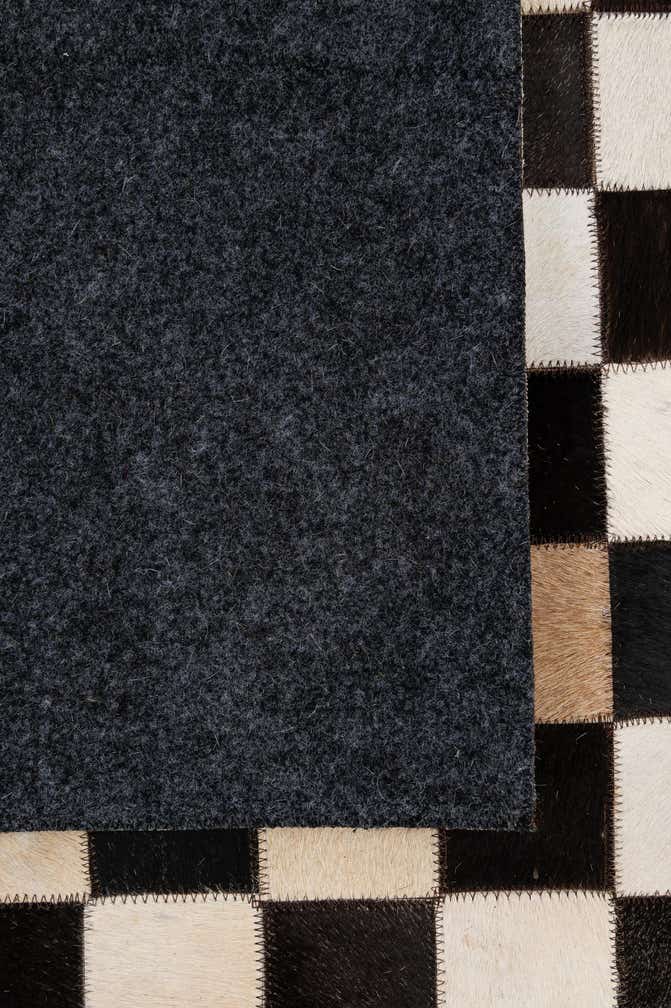 4' 11 x 8' 1 Cowhide - Patchwork Rug