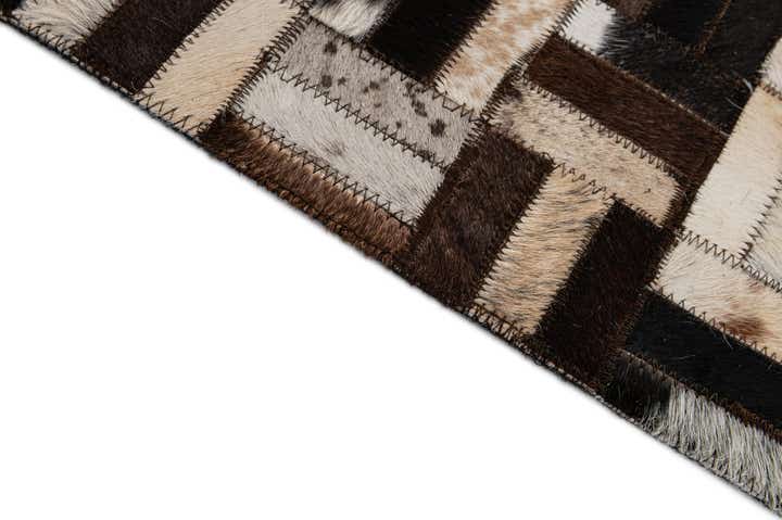 4' 11 x 7' 10 Cowhide - Patchwork Rug