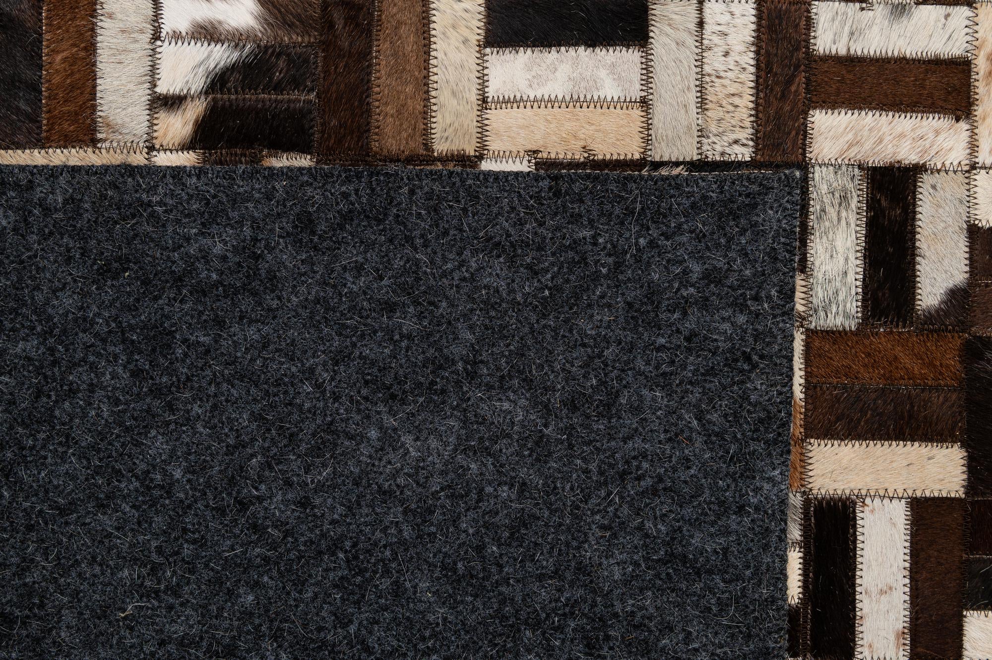 4' 11 x 7' 10 Cowhide - Patchwork Rug
