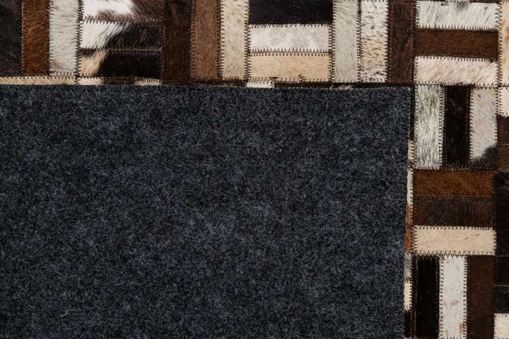 4' 11 x 7' 10 Cowhide - Patchwork Rug