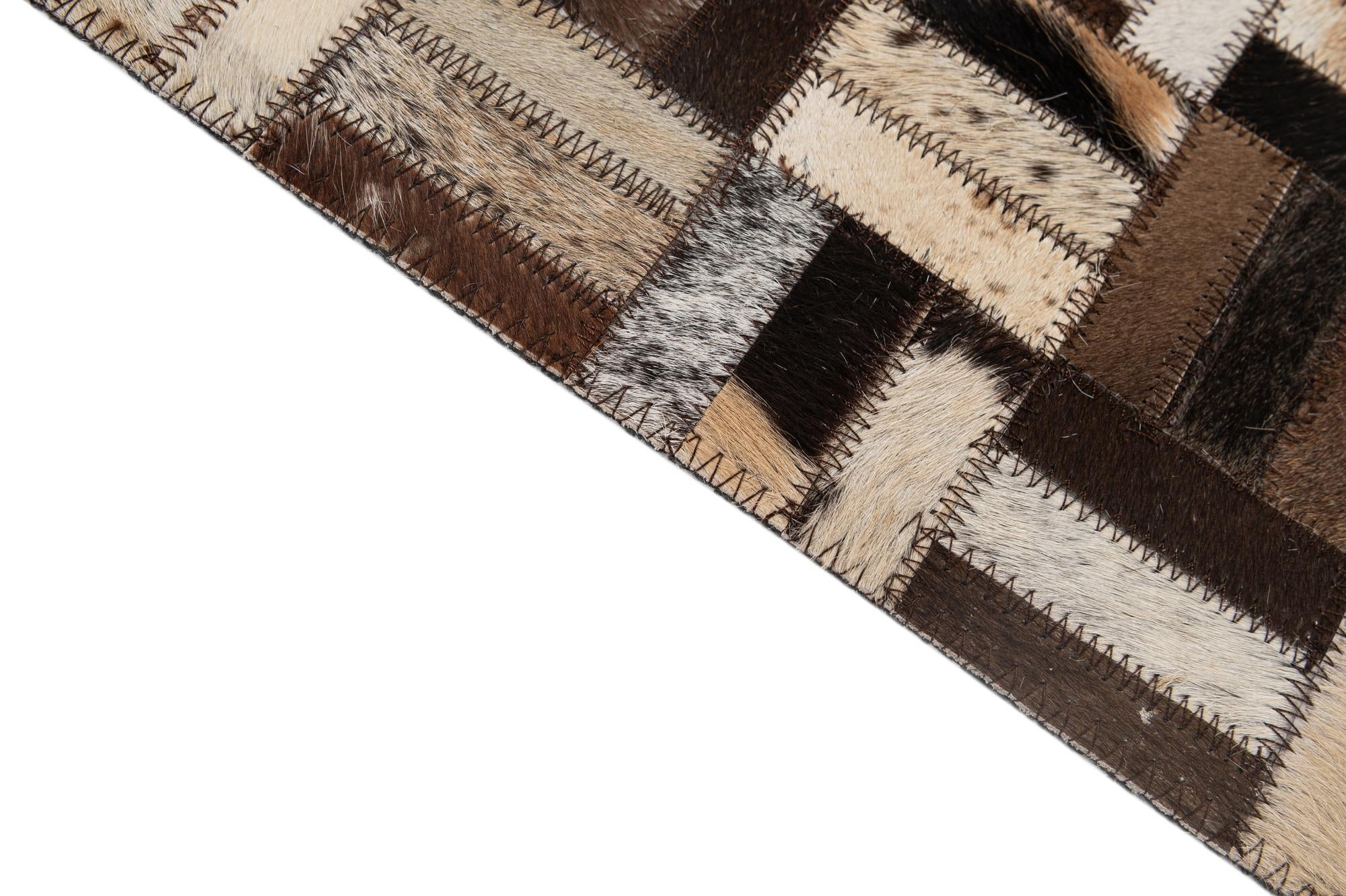 5' 2 x 8' 1 Cowhide - Patchwork Rug