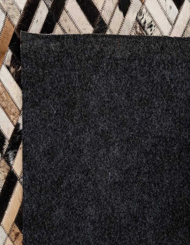 Detail image of 4' 11 x 7' 10 Cowhide - Patchwork Rug