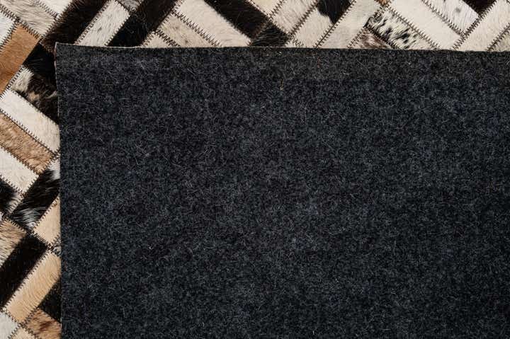 4' 11 x 7' 10 Cowhide - Patchwork Rug
