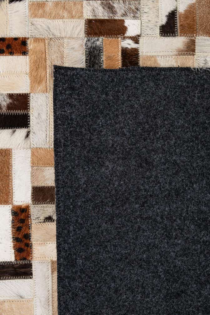 5' 1 x 7' 11 Cowhide - Patchwork Rug