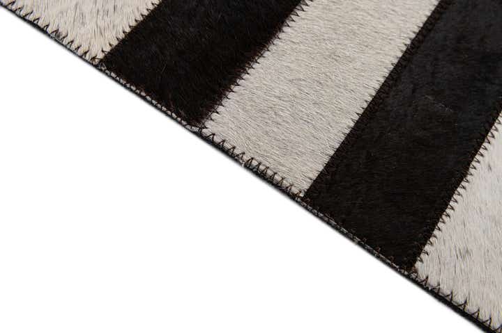 4' 11 x 7' 11 Cowhide - Patchwork Rug