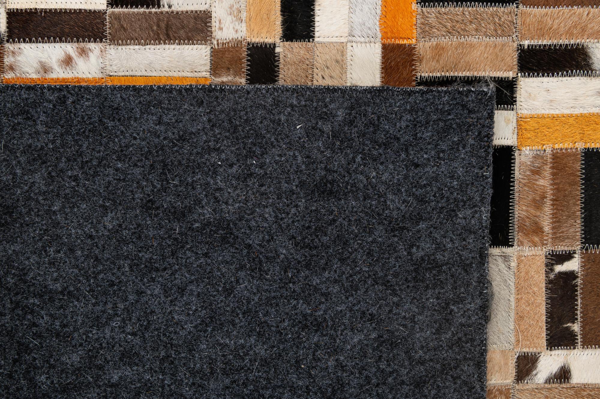 4' 11 x 7' 10 Cowhide - Patchwork Rug